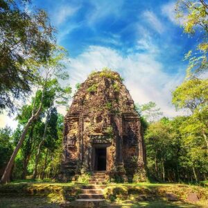 Cambodia Ancient Khmer pre Angkor architecture Sambor Prei Kuk temple ruins with giant banyan trees under blue sky